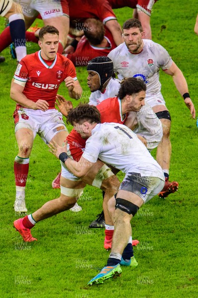 270221 - Wales v England - Guinness Six Nations - Josh Navidi of Wales is tackled by Maro Itoje of England  and Tom Curry of England 