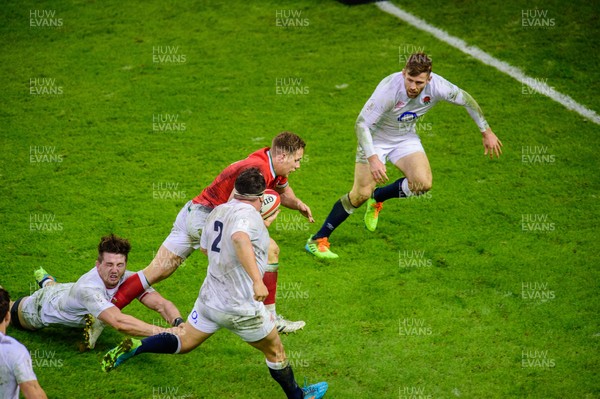 270221 - Wales v England - Guinness Six Nations - Kieran Hardy of Wales  makes a break to score