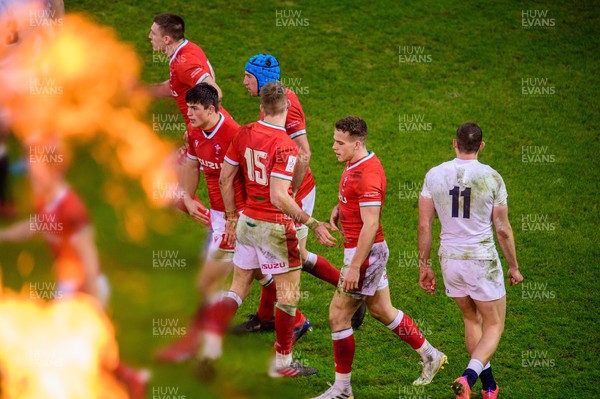 270221 - Wales v England - Guinness Six Nations - Wales players congratulate Kieran Hardy of Wales after his try