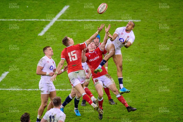 270221 - Wales v England - Guinness Six Nations - Anthony Watson of England  and Liam Williams of Wales compete for the high ball