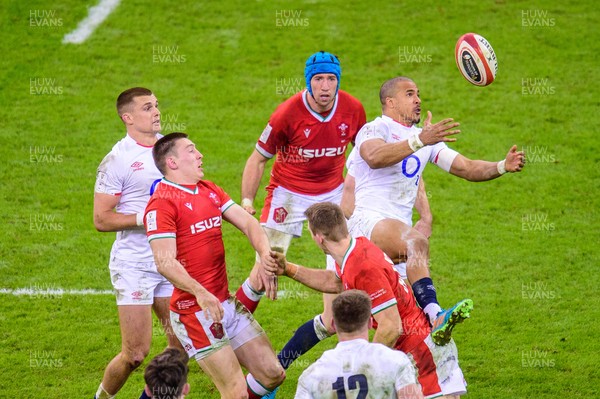 270221 - Wales v England - Guinness Six Nations - Anthony Watson of England  and Liam Williams of Wales compete for the high ball