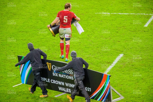 270221 - Wales v England - Guinness Six Nations - Alun Wyn Jones of Wales helps the ground staff clear the pitch
