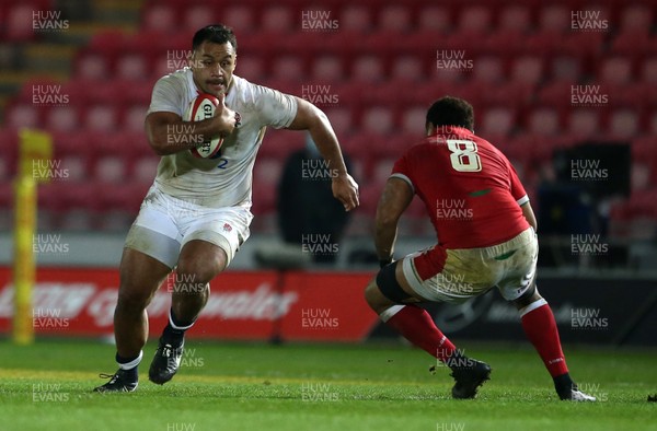 281120 - Wales v England - Autumn Nations Cup 2020 - Billy Vunipola of England is tackled by Taulupe Faletau of Wales