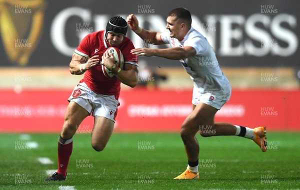 281120 - Wales v England - Autumn Nations Cup - Leigh Halfpenny of Wales is tackled by Henry Slade of England