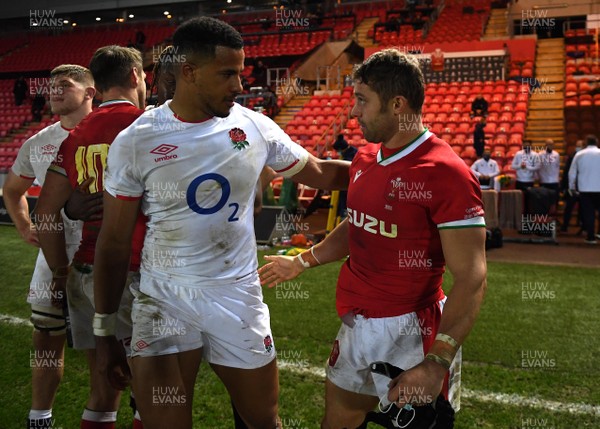 281120 - Wales v England - Autumn Nations Cup - Anthony Watson of England and Leigh Halfpenny of Wales at the end of the game