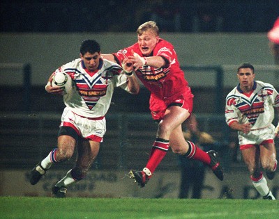 010295 - Wales v England - Rugby League - Ikram Butt of England is tackled by Paul Moriarty of Wales