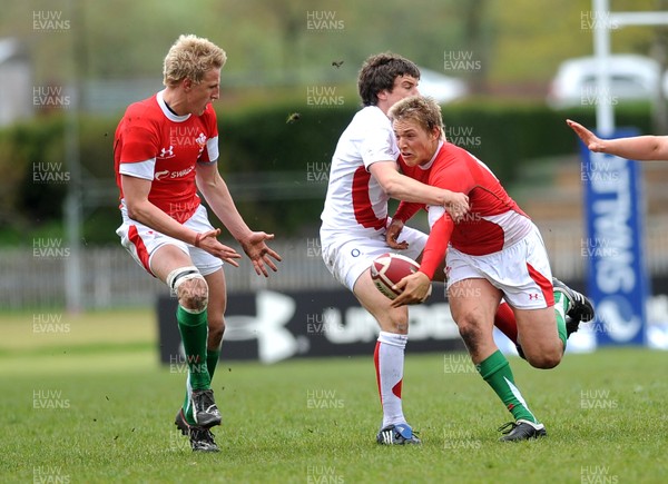 26.04.09 - Under 18 Six Nations Rugby -  Wales  England -  Wales' Lewis Robling passes to Ben John  as he is tackled 