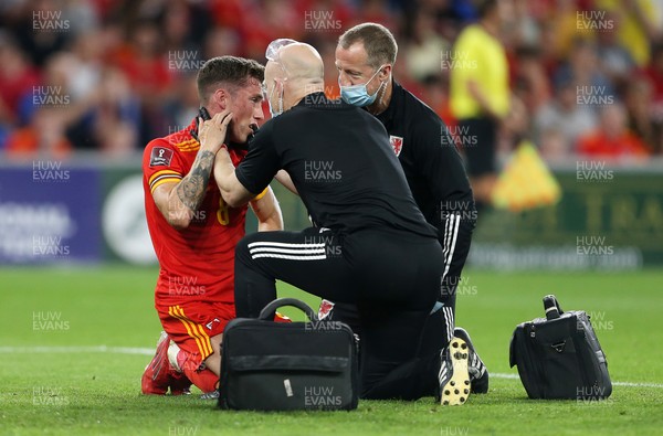 080921 - Wales v Estonia, World Cup 2022 Qualifying - Harry Wilson of Wales is looked at by medics after colliding the Estonia goalkeeper Karl Hein in the penalty box