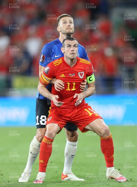 080921 - Wales v Estonia, World Cup 2022 Qualifying - Gareth Bale of Wales is held by Karol Mets of Estonia