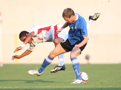 29.05.09 - Wales v Estonia, International Friendy, Llanelli -  Wales' Ashley Williams  is brought down by Estonia's Alo Dupikov  