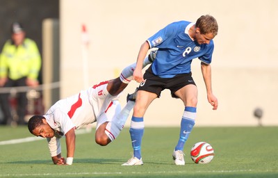 29.05.09 - Wales v Estonia, International Friendy, Llanelli -  Wales' Ashley Williams  is brought down by Estonia's Alo Dupikov  