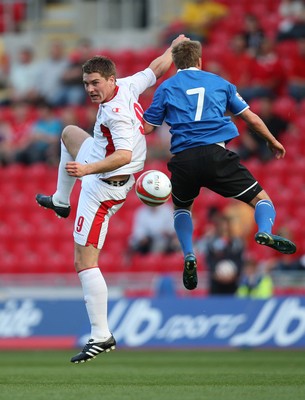 29.05.09 - Wales v Estonia, International Friendy, Llanelli -  Wales' Sam Vokes gets the better of Estonia's Sander Puri  