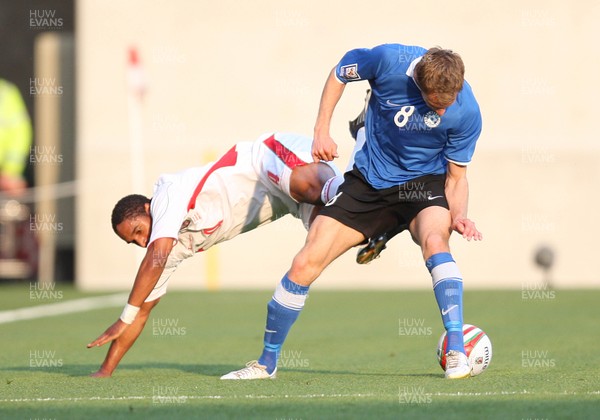 29.05.09 - Wales v Estonia, International Friendy, Llanelli -  Wales' Ashley Williams  is brought down by Estonia's Alo Dupikov  