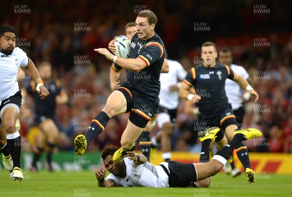 011015 - Wales v Fiji - Rugby World Cup 2015 -George North of Wales is tackled by Metuisela Talebula of Fiji