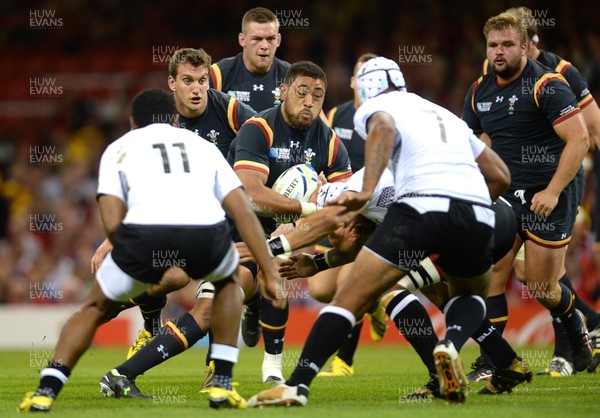 011015 - Wales v Fiji - Rugby World Cup 2015 -Taulupe Faletau of Wales is tackled by Netani Talei of Fiji