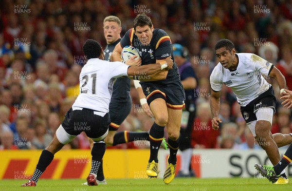 011015 - Wales v Fiji - Rugby World Cup 2015 -James Hook of Wales is tackle by Henry Seniloli of Fiji