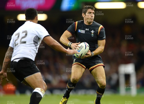 011015 - Wales v Fiji - Rugby World Cup 2015 -James Hook of Wales takes on Joshua Matavesi of Fiji