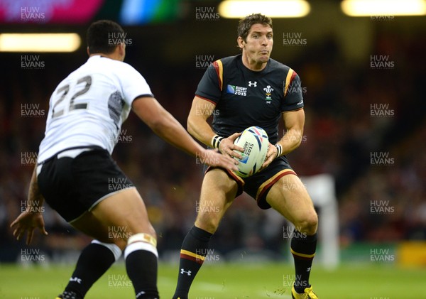 011015 - Wales v Fiji - Rugby World Cup 2015 -James Hook of Wales takes on Joshua Matavesi of Fiji