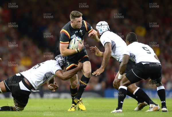 011015 - Wales v Fiji - Rugby World Cup 2015 -Alex Cuthbert of Wales is tackled by Leone Nakarawa and Akapusi Qera of Fiji