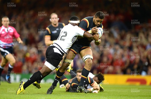 011015 - Wales v Fiji - Rugby World Cup 2015 -Taulupe Faletau of Wales is tackled by Lepani Botia of Fiji