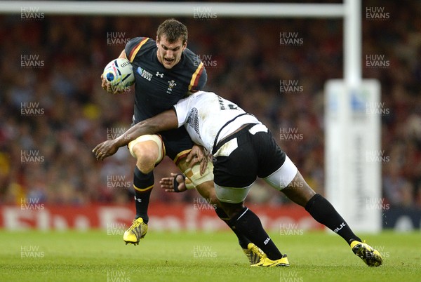 011015 - Wales v Fiji - Rugby World Cup 2015 -Sam Warburton of Wales is tackled by Lepani Botia of Fiji