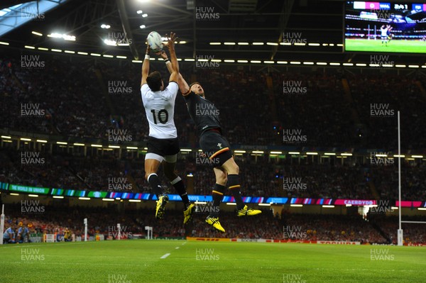 011015 - Wales v Fiji - Rugby World Cup 2015 -Ben Volavola of Fiji and Alex Cuthbert of Wales compete in the air