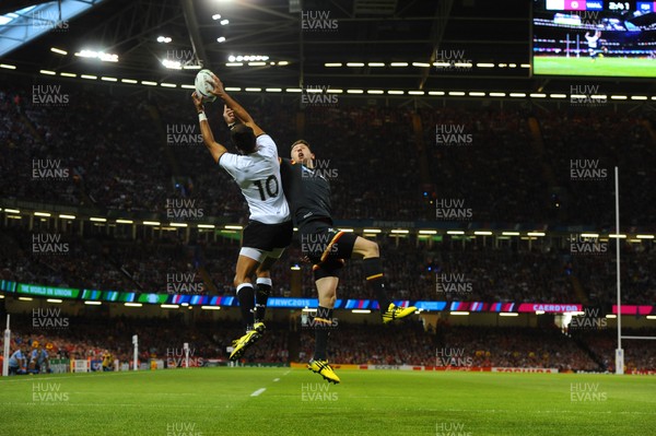 011015 - Wales v Fiji - Rugby World Cup 2015 -Ben Volavola of Fiji and Alex Cuthbert of Wales compete in the air