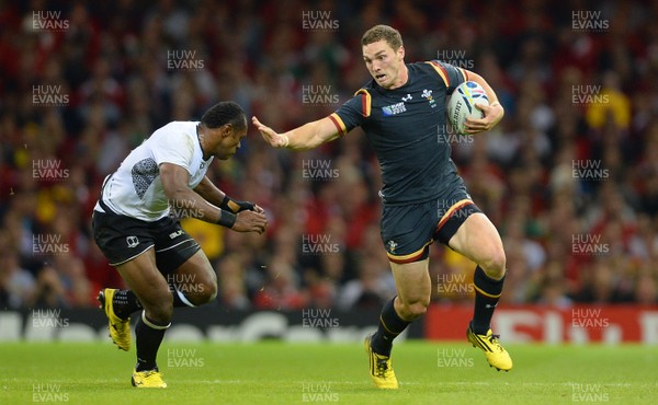 011015 - Wales v Fiji - Rugby World Cup 2015 -George North of Wales takes on Vereniki Goneva of Fiji