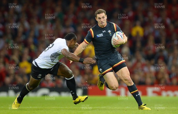 011015 - Wales v Fiji - Rugby World Cup 2015 -George North of Wales takes on Vereniki Goneva of Fiji