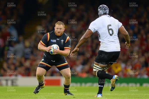 011015 - Wales v Fiji - Rugby World Cup 2015 -Samson Lee of Wales is tackle by Dominiko Waqaniburotu of Fiji