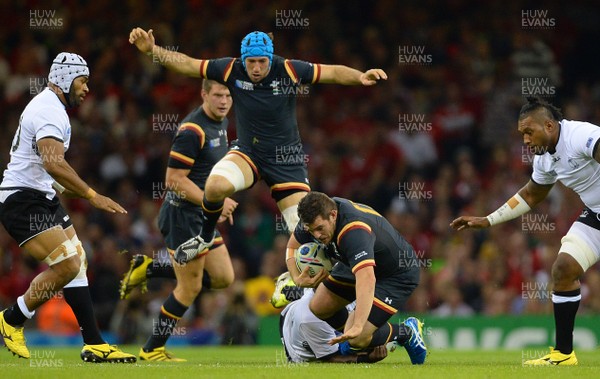 011015 - Wales v Fiji - Rugby World Cup 2015 -Aaron Jarvis of Wales is tackled by Manasa Saulo of Fiji