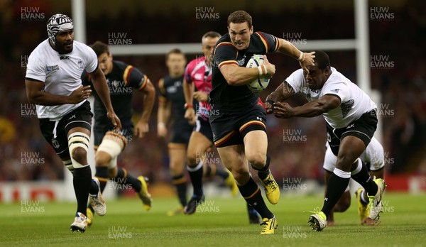 011015 - Wales v Fiji - Rugby World Cup - George North of Wales smashes past Manasa Saulo of Fiji