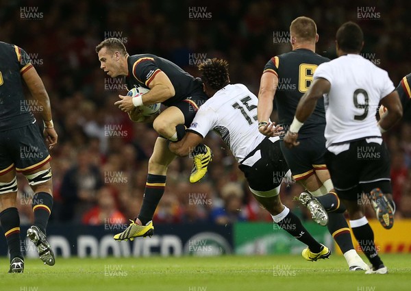 011015 - Wales v Fiji - Rugby World Cup - Gareth Davies of Wales is tackled by Metuisela Talebula of Fiji