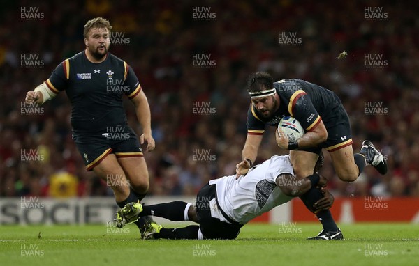 011015 - Wales v Fiji - Rugby World Cup - Scott Baldwin of Wales is tackled by Tevita Cavubati of Fiji