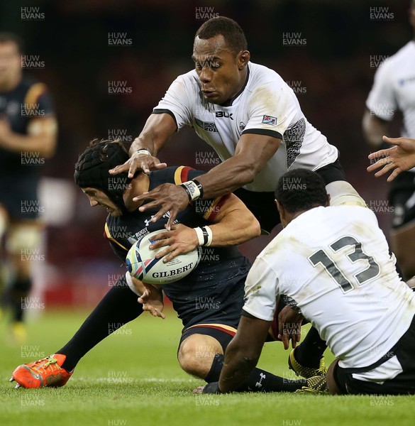 011015 - Wales v Fiji - Rugby World Cup - Matthew Morgan of Wales is tackled by Leone Nakarawa of Fiji