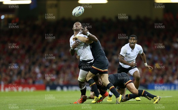 011015 - Wales v Fiji - Rugby World Cup - Leone Nakarawa of Fiji looses the ball whilst being tackled by Dan Biggar and Gareth Davies of Wales