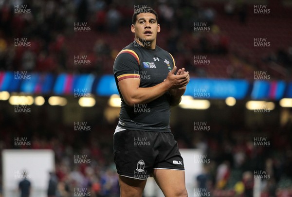 011015 - Wales v Fiji - Rugby World Cup - Joshua Matavesi of Fiji wears Dan Biggar of Wales shirt at full time