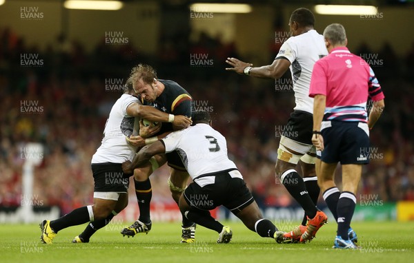 011015 - Wales v Fiji - Rugby World Cup - Alun Wyn Jones of Wales is tackled by Sunia Koto and Manasa Saulo of Fiji