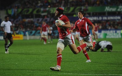 02.10.11 - Wales v Fiji - Rugby World Cup 2011 - Leigh Halfpenny of Wales runs in to score try. 