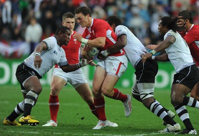 02.10.11 - Wales v Fiji - Rugby World Cup 2011 - George North of Wales is tackled by Wame Lewaravu(R). 