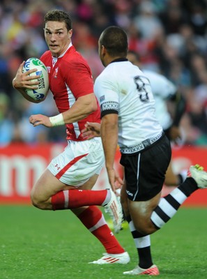 02.10.11 - Wales v Fiji - Rugby World Cup 2011 - George North of Wales is tackled by Vitori Buatava(R) of Fiji. 
