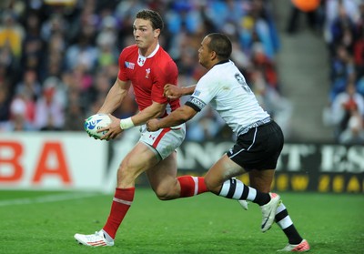 02.10.11 - Wales v Fiji - Rugby World Cup 2011 - George North of Wales is tackled by Vitori Buatava(R) of Fiji. 