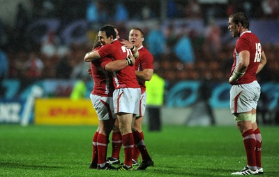 02.10.11 - Wales v Fiji - Rugby World Cup 2011 - Adam Jones and Stephen Jones of Wales celebrate at the end of the game. 