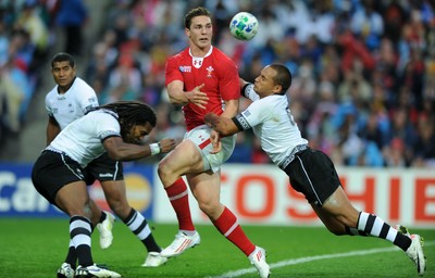 02.10.11 - Wales v Fiji - Rugby World Cup 2011 - George North of Wales is tackled by Vitori Buatava(R) of Fiji. 