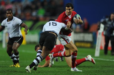 02.10.11 - Wales v Fiji - Rugby World Cup 2011 - Mike Phillips of Wales is tackled by Iliesa Keresoni of Fiji. 
