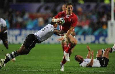 02.10.11 - Wales v Fiji - Rugby World Cup 2011 - George North of Wales breaks past Iliesa Keresoni of Fiji. 