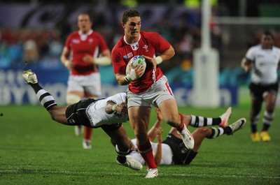 02.10.11 - Wales v Fiji - Rugby World Cup 2011 - George North of Wales breaks past Iliesa Keresoni of Fiji. 