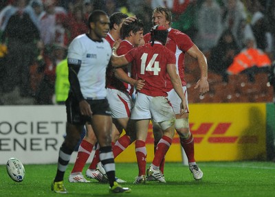 02.10.11 - Wales v Fiji - Rugby World Cup 2011 - Lloyd Williams of Wales celebrates his try with George North, Andy Powell and Leigh Halfpenny. 