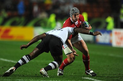 02.10.11 - Wales v Fiji - Rugby World Cup 2011 - Jonathan Davies of Wales takes on Vereniki Goneva of Fiji. 