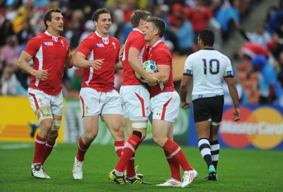 02.10.11 - Wales v Fiji - Rugby World Cup 2011 - Scott Williams of Wales celebrates his try with Rhys Priestland. 